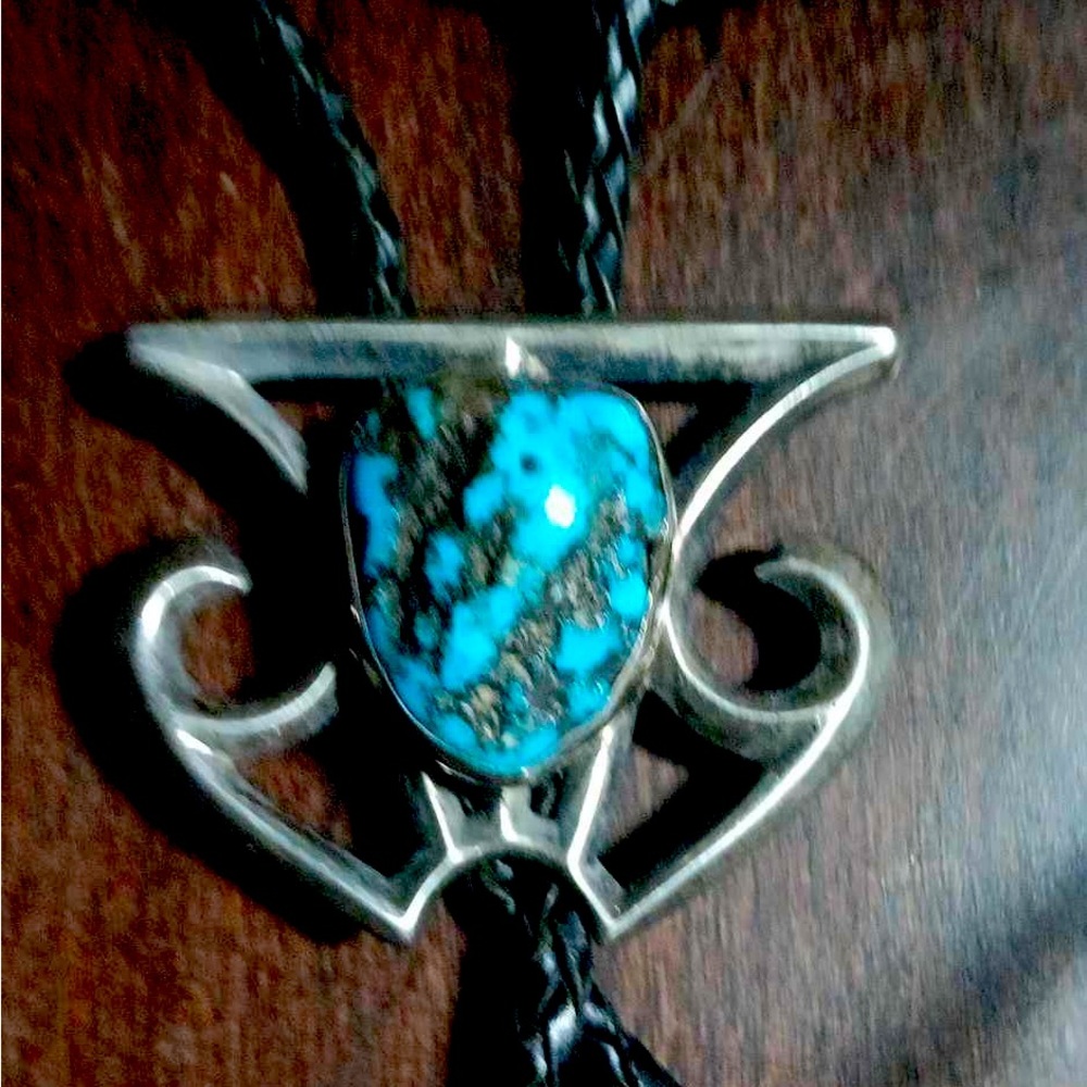 Native American bolo with turquoise stone set in a beautiful siver pennent